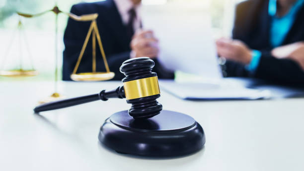 istock Lawyers discuss together at work. 1207538975