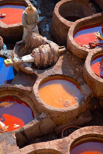 Leather dying in a traditional tannery in the city Fes, Morocco on January 18, 2020.