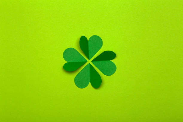 istock St. Patrick 's Day (St. Paddyâs Day) background concept. Green clover from paper on a green background. Clover is a symbol of Ireland and Celtic culture 1207539082