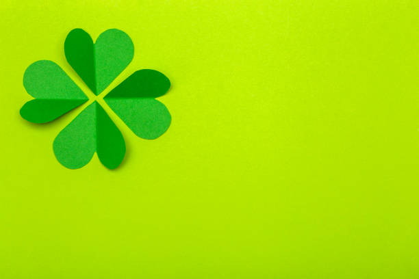 istock St. Patrick 's Day (St. Paddyâs Day) background concept. Green clover from paper on a green background. Clover is a symbol of Ireland and Celtic culture 1207539086