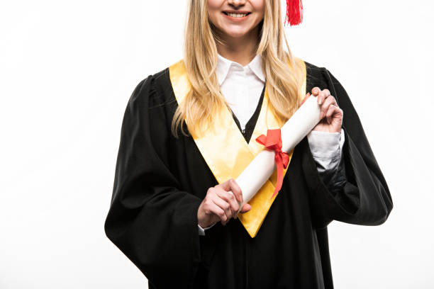 istock Front view of student holding diploma isolated on white 1207539188
