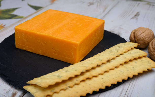 istock Leicestershire cheese or red leicester, British hard cheese made from cow milk 1207540491