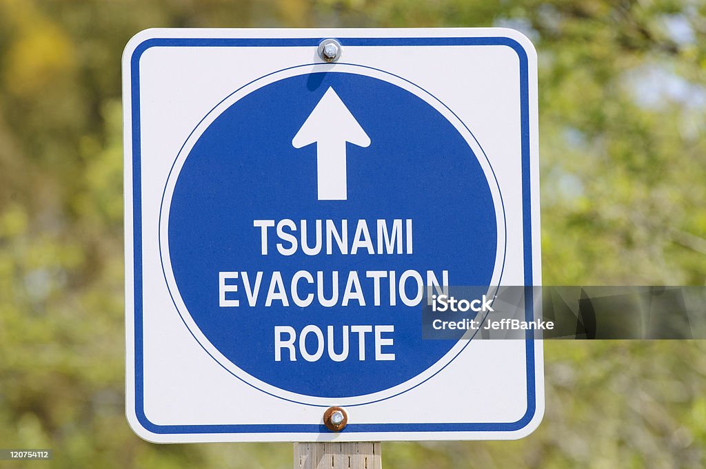 Tsunami evacuation route Tsunami road sign showing evacuation route, near Pescadero, California California Stock Photo