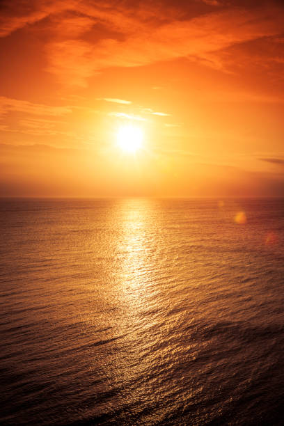 istock Red sunset by the sea 1207541388