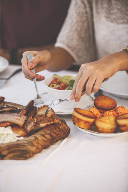 istock Female hands taking a piece of meat 1207542271