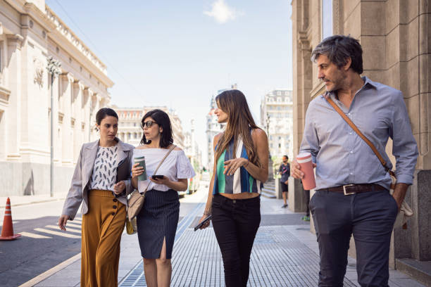 istock Carefree coworkers using their coffee break to enjoy sunny day 1207543656