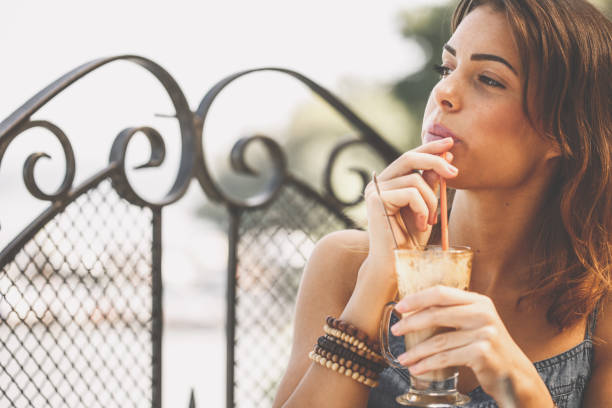 istock Young woman sipping coffee and contemplating 1207543844