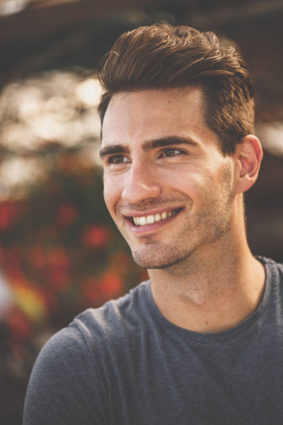 istock Young man smiling in casual look 1207543894