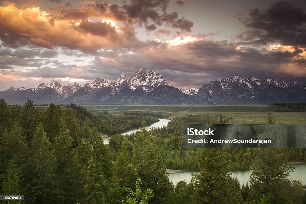 After the Storm Storm clouds breaking up over the Grand Teton mountains as viewed at evening from the Snake River Overlook. Grand Teton Stock Photo