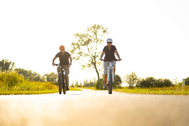 istock active senior couple cycling at sunset 1207545927