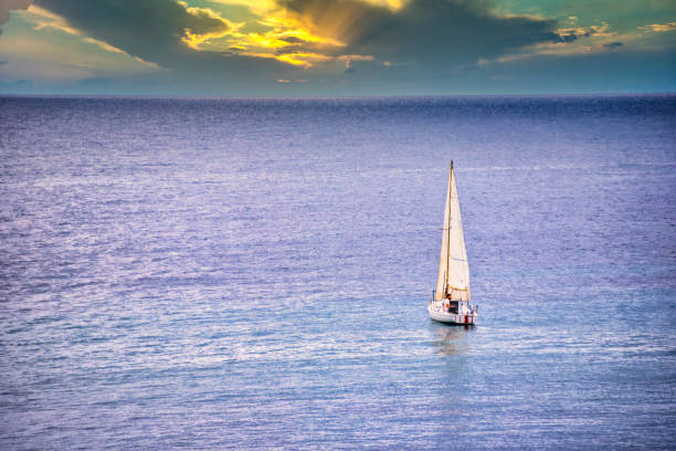 istock Sailboat on the Blue Mediterranean Sea at Sunset 1207546093