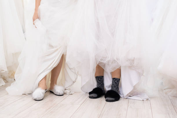 istock Women Wearing Wedding Dresses And Slippers 1207546291
