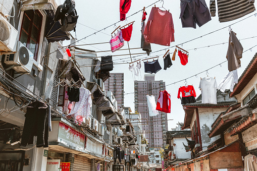 Shanghai, China - April 20, 2018: clothes hanging for drying in the air in old Shanghai Quarter
