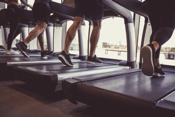 istock Unrecognizable group of people using treadmills at the gym 1207547921