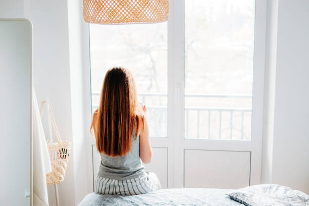 istock Getting ready. Morning routine with rumpled bed and tea. Woman waking up at home. 1207548821