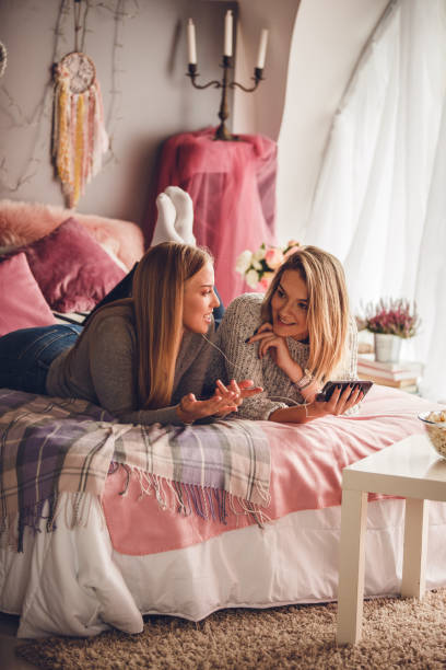 istock Girlfriends having a chat about the video they are watching 1207549445