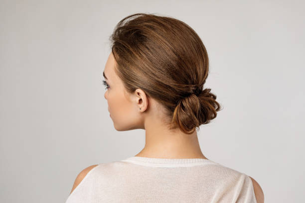 Woman With Creative Elegant Hair Bun Stock Photo - Download Image Now - Hair  Bun, Women, Rear View - iStock
