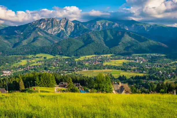 Panoramic view of Tatra Mountains with Giewont and Czerwone Wierchy peaks seen from the Gubalowka hill in Zakopane resort, Poland