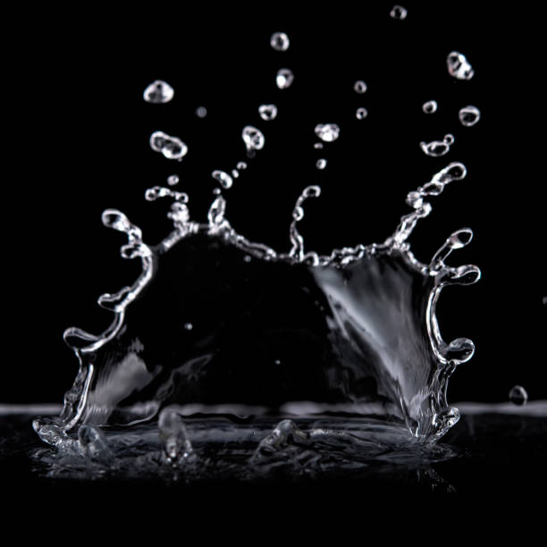 istock Water splash isolated on black background.  Water texture. 1207550475
