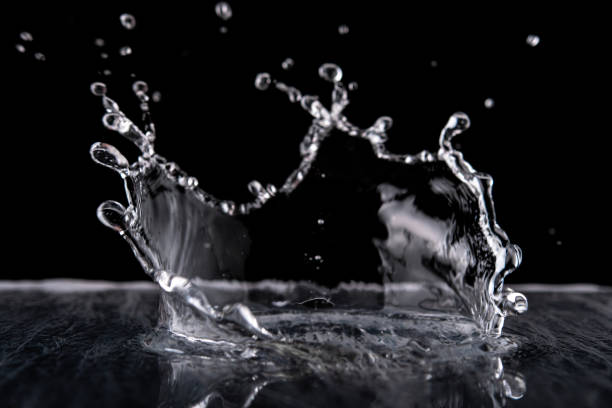 istock Water splash isolated on black background.  Water texture. 1207550477