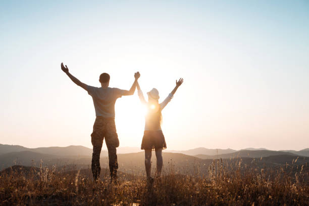 istock Guy and girl conquered the top 1207551131