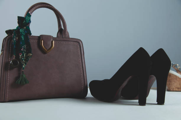 istock woman shoes with bag 1207552421