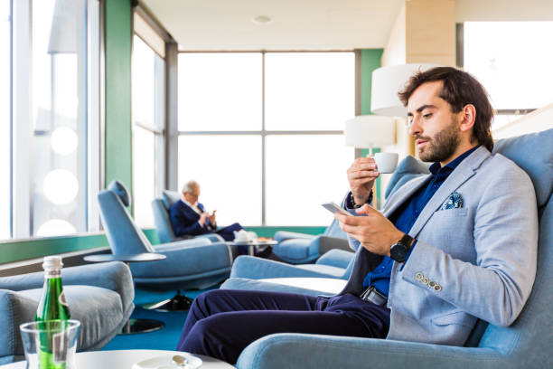 business people waiting for flight in the aiport vip lounge - airport waiting room waiting airport lounge imagens e fotografias de stock