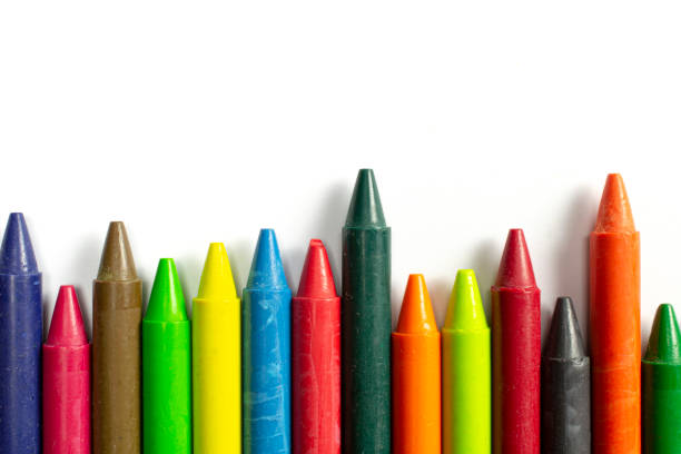 istock Colourful bright wax pencils isolated on white, close-up selective focus. 1207555683