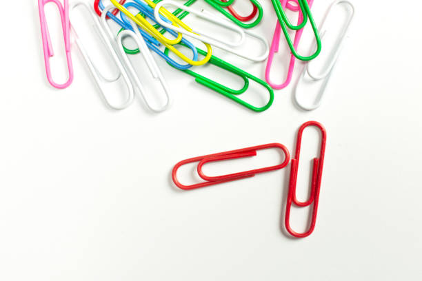 istock Colorful paper clips isolated on white close-up view. 1207555748
