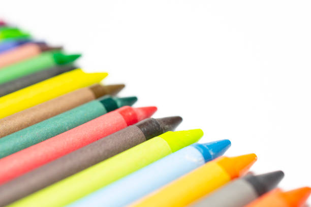 istock Colourful bright wax pencils isolated on white, close-up selective focus. 1207555806