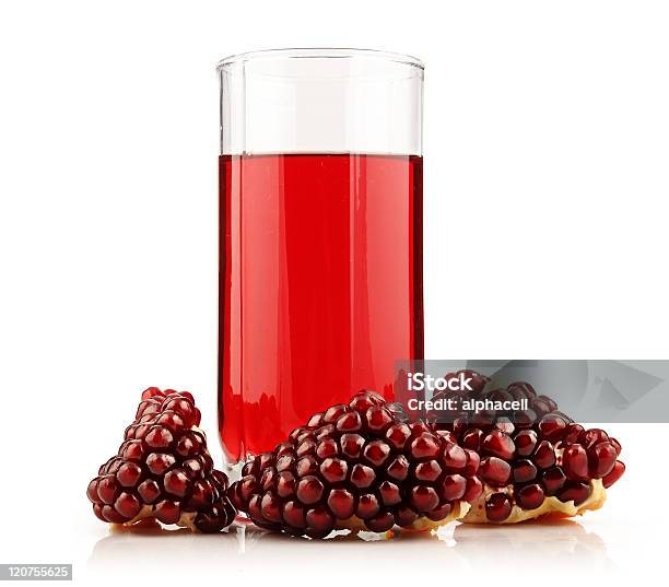 Glass Of Pomegranate Juice With Sliced Fruits Isolated Stock Photo - Download Image Now