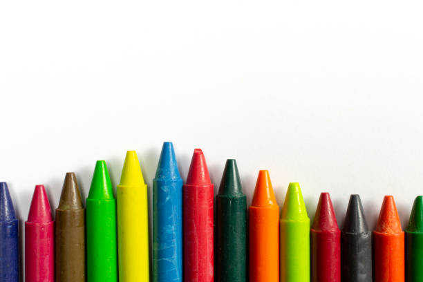 istock Colourful bright wax pencils isolated on white, close-up selective focus. 1207556859