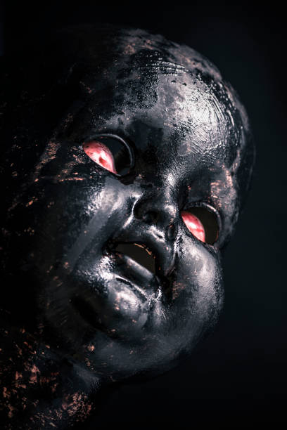 istock Creepy doll in the dark 1207557497