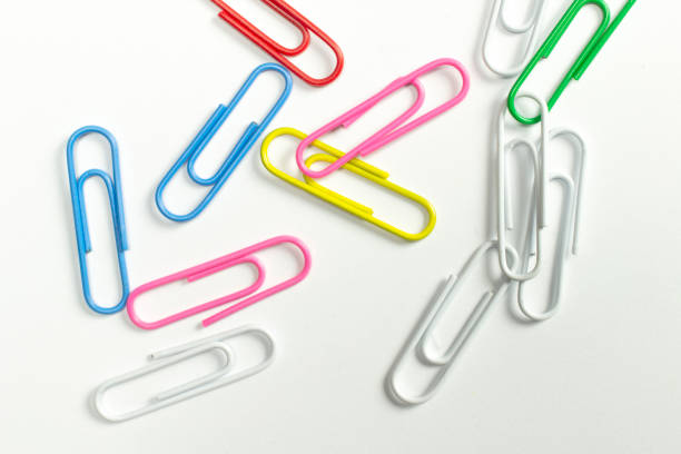 istock Colorful paper clips isolated on white close-up view. 1207557760