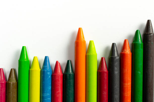 istock Colourful bright wax pencils isolated on white, close-up selective focus. 1207557778