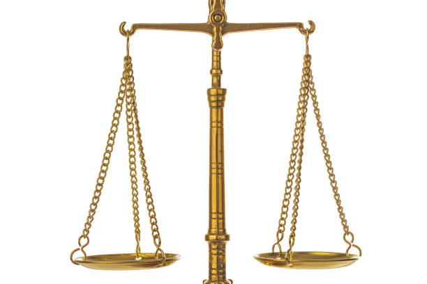 istock Golden weight balance scale 1207559855