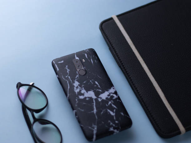 istock custom phone skin flatlay with different background colour. 1207560243