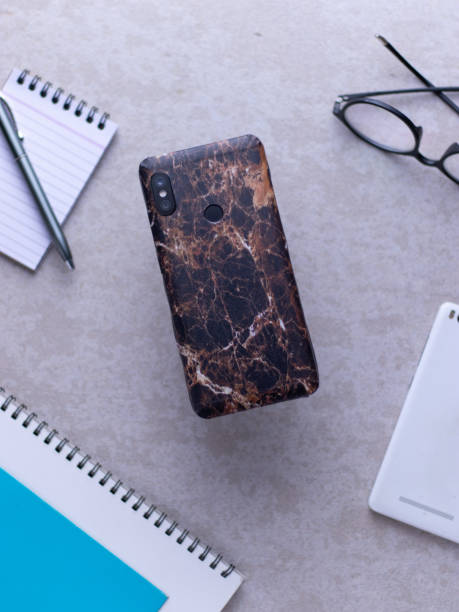 istock custom phone skin flatlay with different background colour. 1207560612