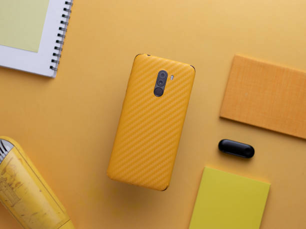 istock custom phone skin flatlay with different background colour. 1207561503