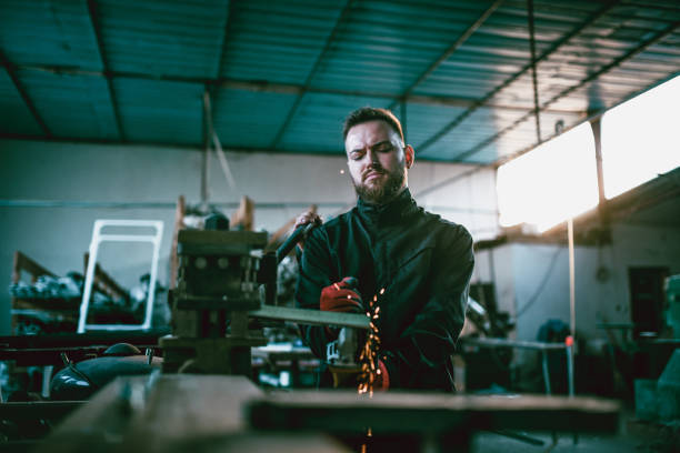 istock Male Worker Shaping Various Metal Materials With Circular Saw 1207562251