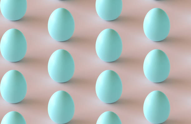 istock 3d render: Seamlessly repeatable pattern of turquoise / cyan pastel colored easter eggs on rose colored background. 1207562507