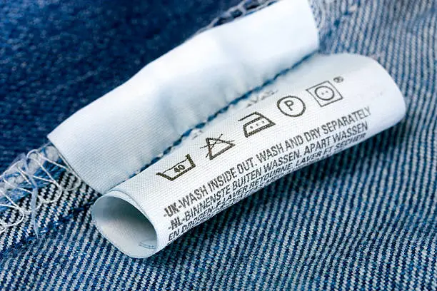 Photo of Care instructions label on the inside of a denim garment