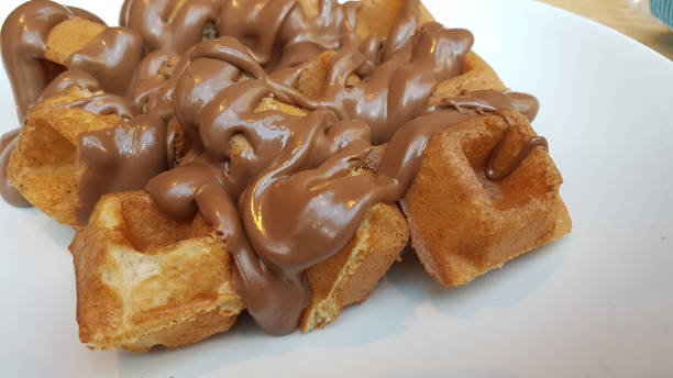 istock waffle sweet chocolated hot  liquid on the plate 1207564153