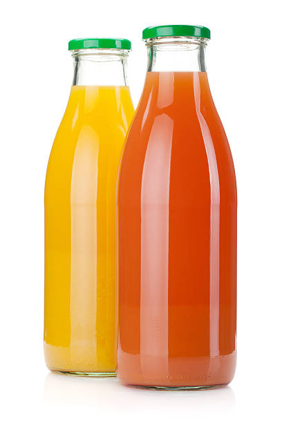 suco de laranja e toranja garrafas - closed multi colored macro equipment - fotografias e filmes do acervo