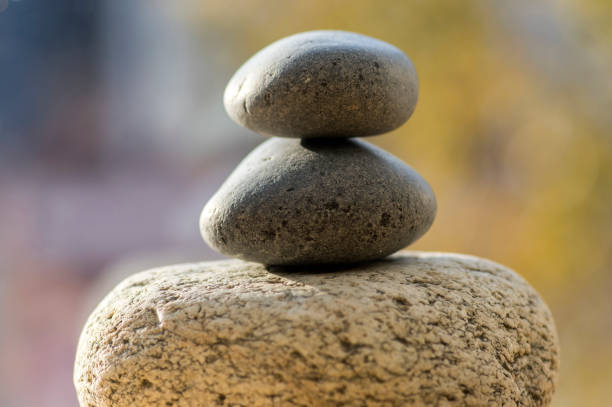 istock Three zen stones pile, white and grey meditation pebbles tower 1207564337