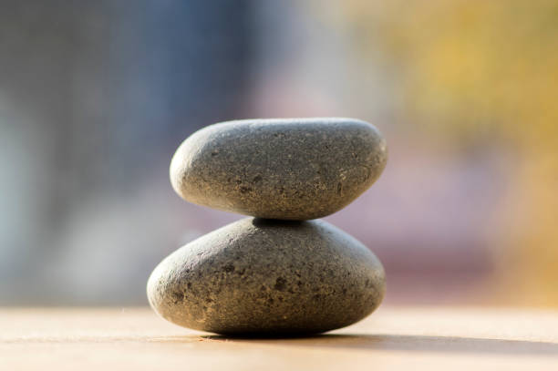 istock Two zen stones pile, grey meditation pebbles tower 1207564340