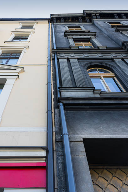 istock Two adjacent buildings, contrasting colors. 1207564453