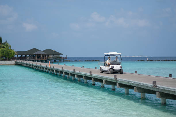 Overwater Bungalows Boardwalk in Maldives paradise island. Male,Maldives - January 25, 2020:Overwater Bungalows Boardwalk in Maldives paradise island. water bungalow maldives stock pictures, royalty-free photos & images