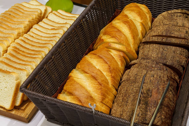 istock Different types of bread, sliced for serving in a restaurant 1207567579