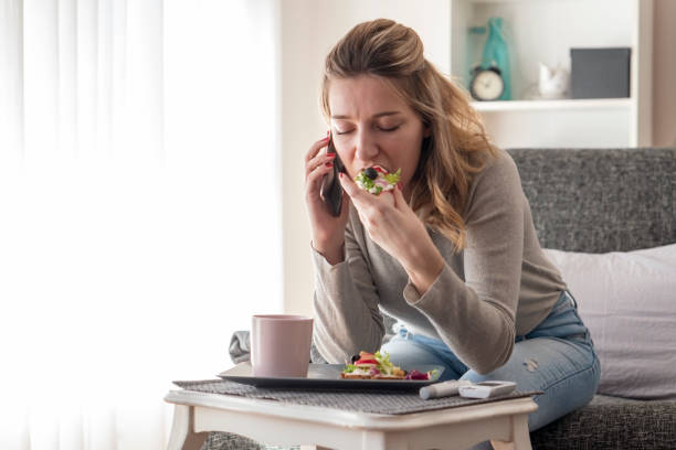 istock Young diabetic woman having breakfast at home 1207571832